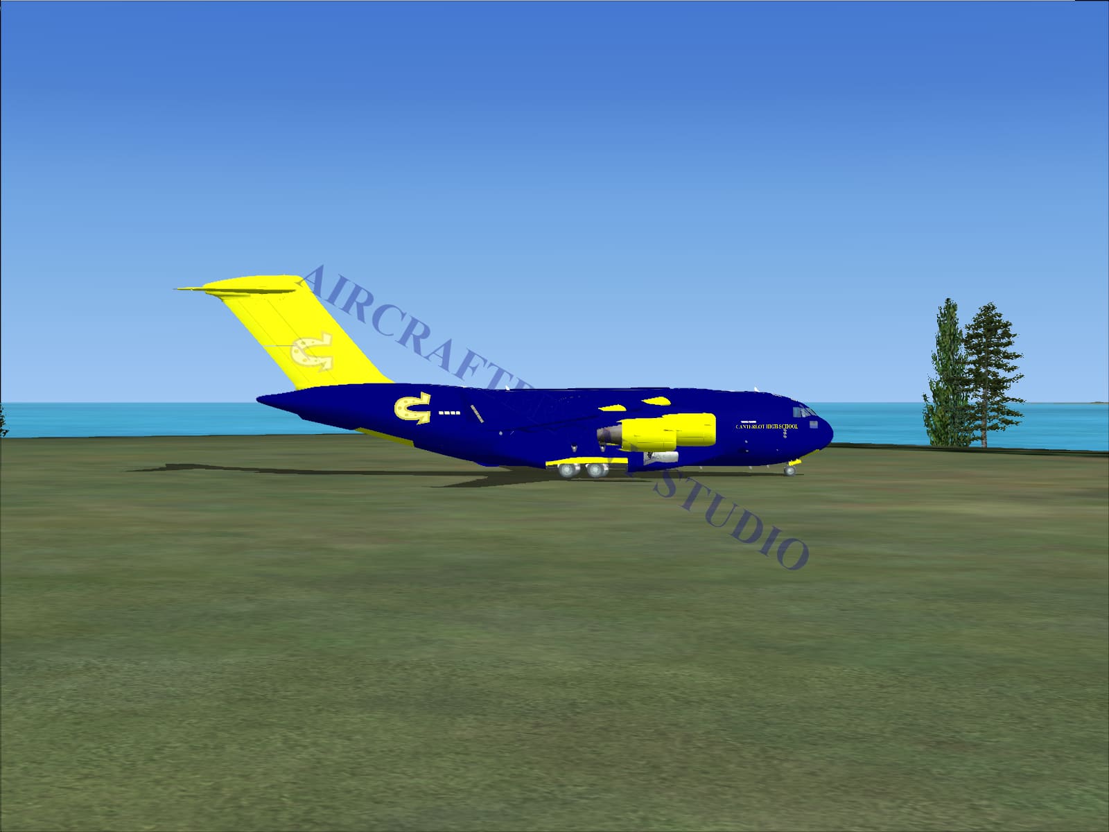 Blue and yellow canterlot high school boeing c-17 cargo aircraft with prominent g logo on its fuselage digital image