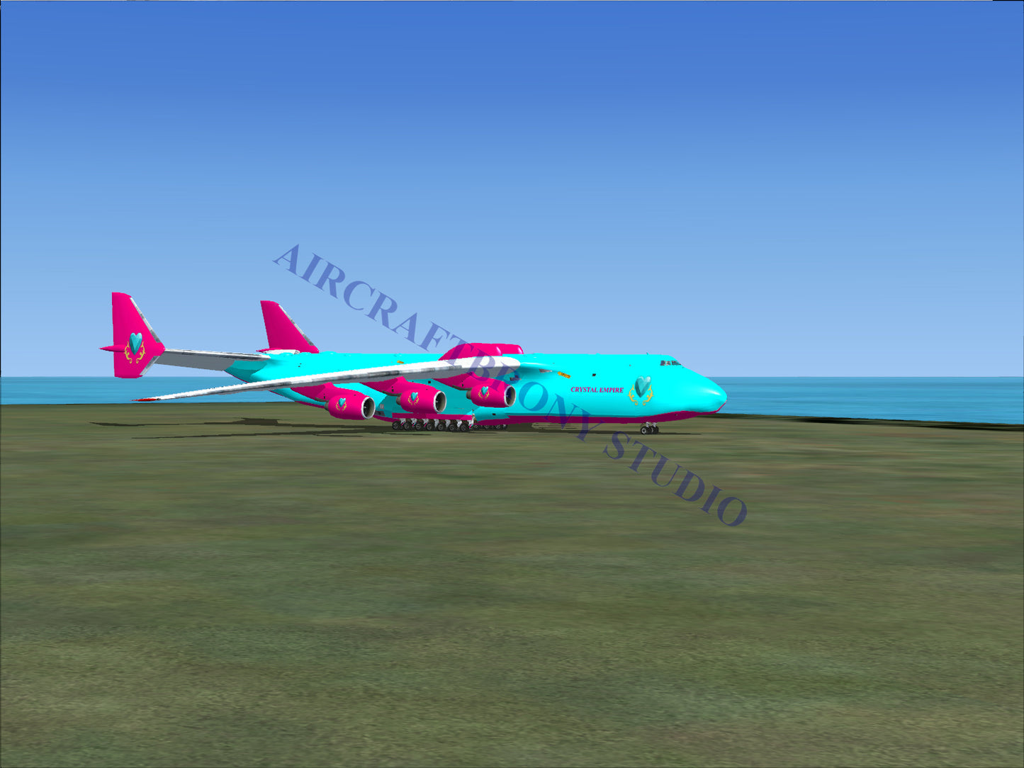 Turquoise and pink cargo plane with large wings.