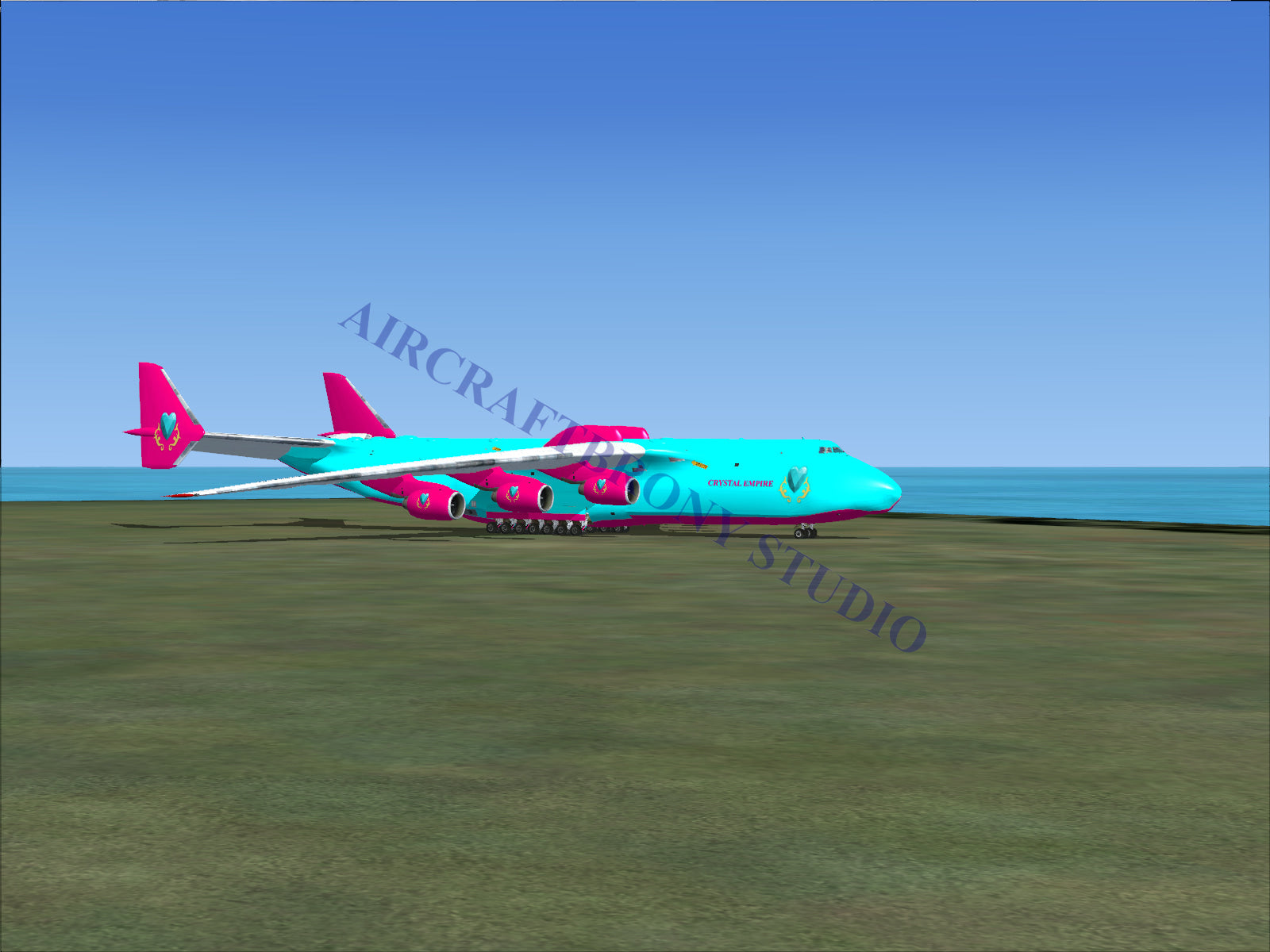 Turquoise and pink cargo plane with large wings.