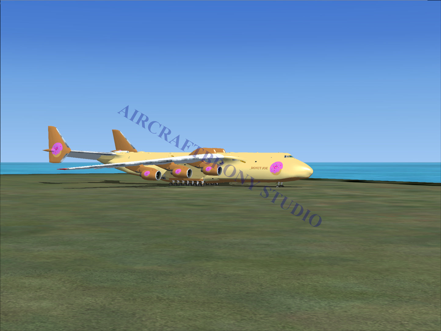 Gold and purple cargo plane model with pink logo design.