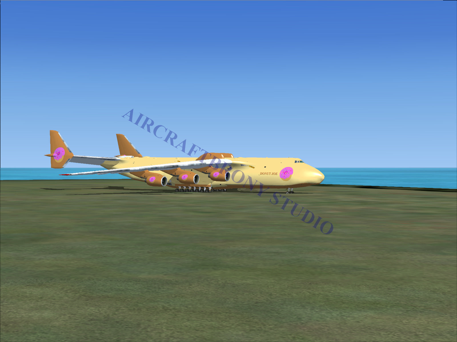 Gold and purple cargo plane model with pink logo design.