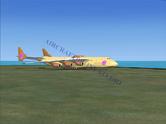 Gold and purple cargo plane model with pink logo design.