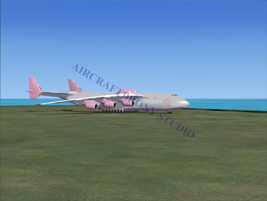 Pink and white cargo plane with large engines.