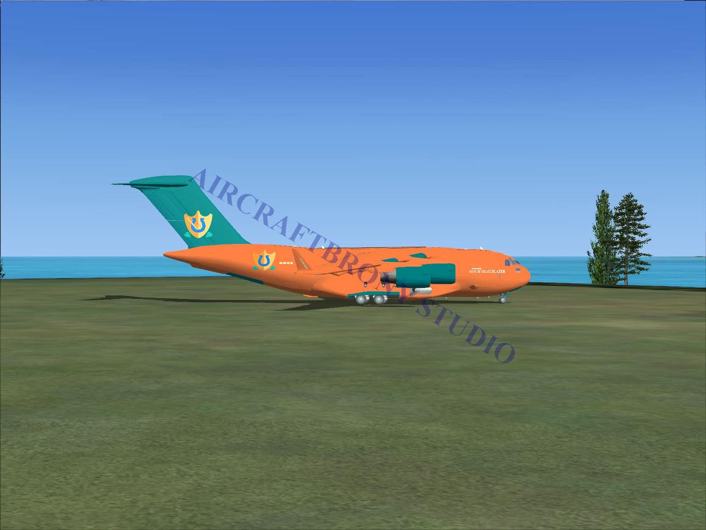 Orange and teal hitch trailblazer boeing c-17 cargo airplane with distinctive tail logo digital image