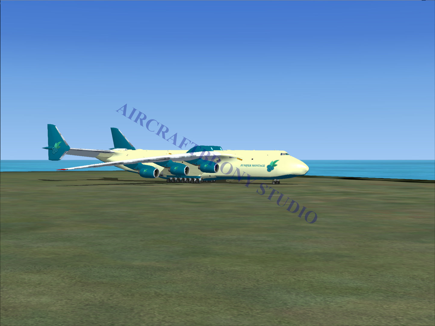 Blue and white cargo plane with teal accents, parked on tarmac near ocean.
