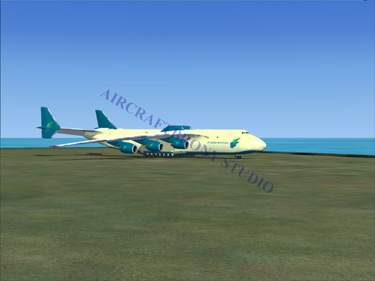 Blue and white cargo plane with teal accents, parked on tarmac near ocean.