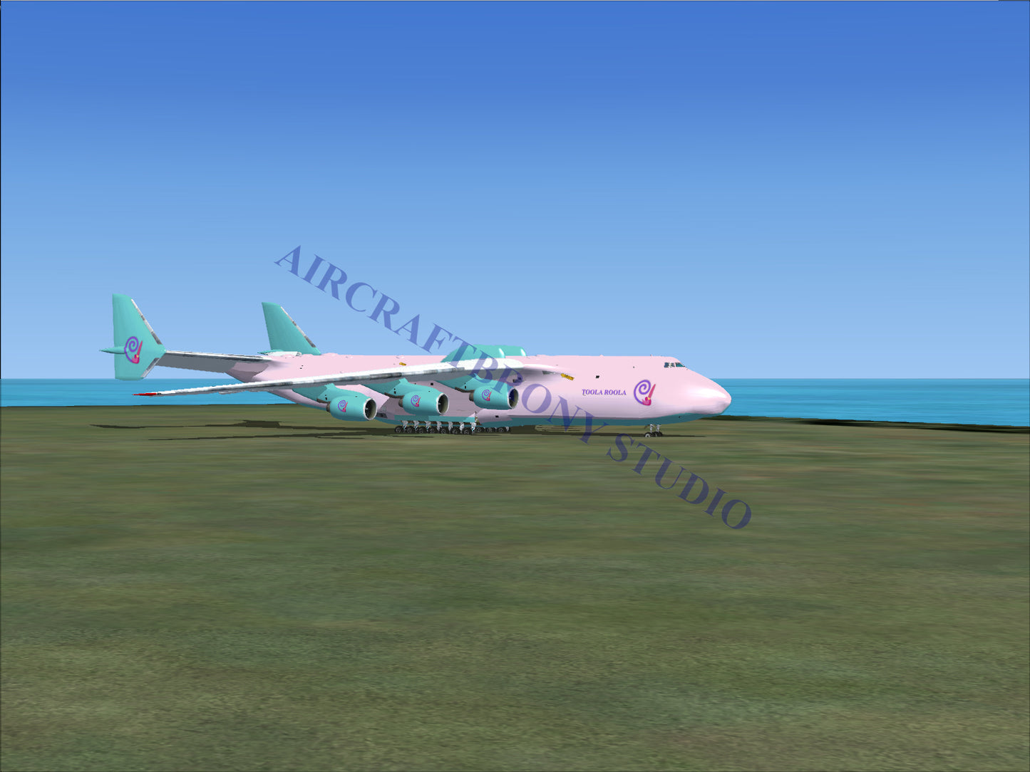 Pink and teal cargo plane model with large engines.