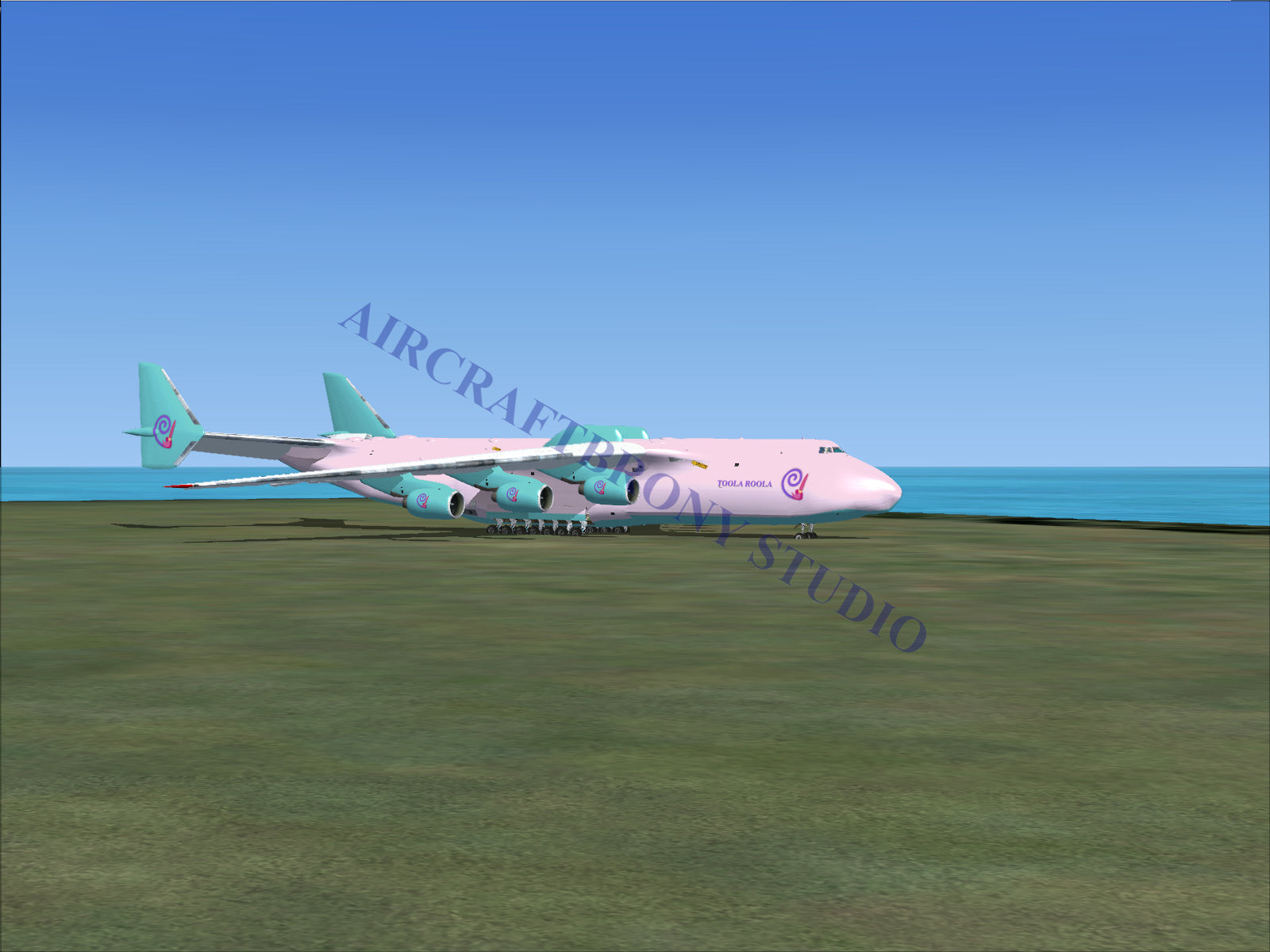 Pink and teal cargo plane model with large engines.