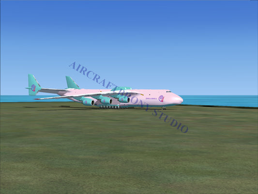 Pink and teal cargo plane model with large engines.